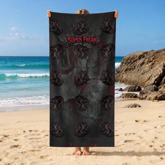 Front vertical hanging view of Beach Towel featuring repeat pattern of creepy mascot