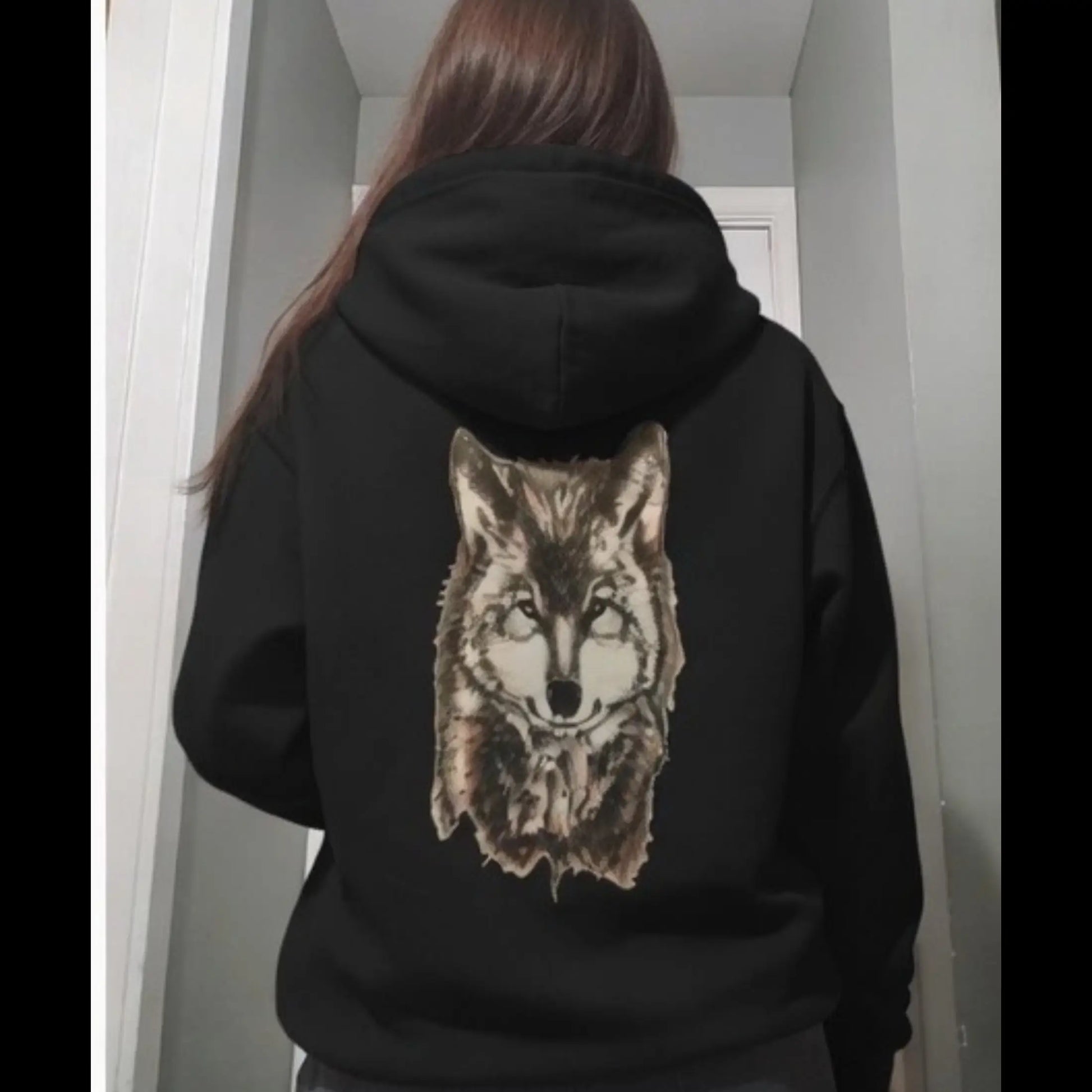 Alpha Wolf dark art hoodie lifestyle shot - back view, hand-drawn wolf husky artwork on black unisex hoodie